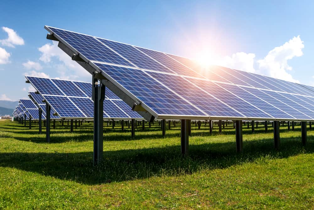 sun setting over solar farm