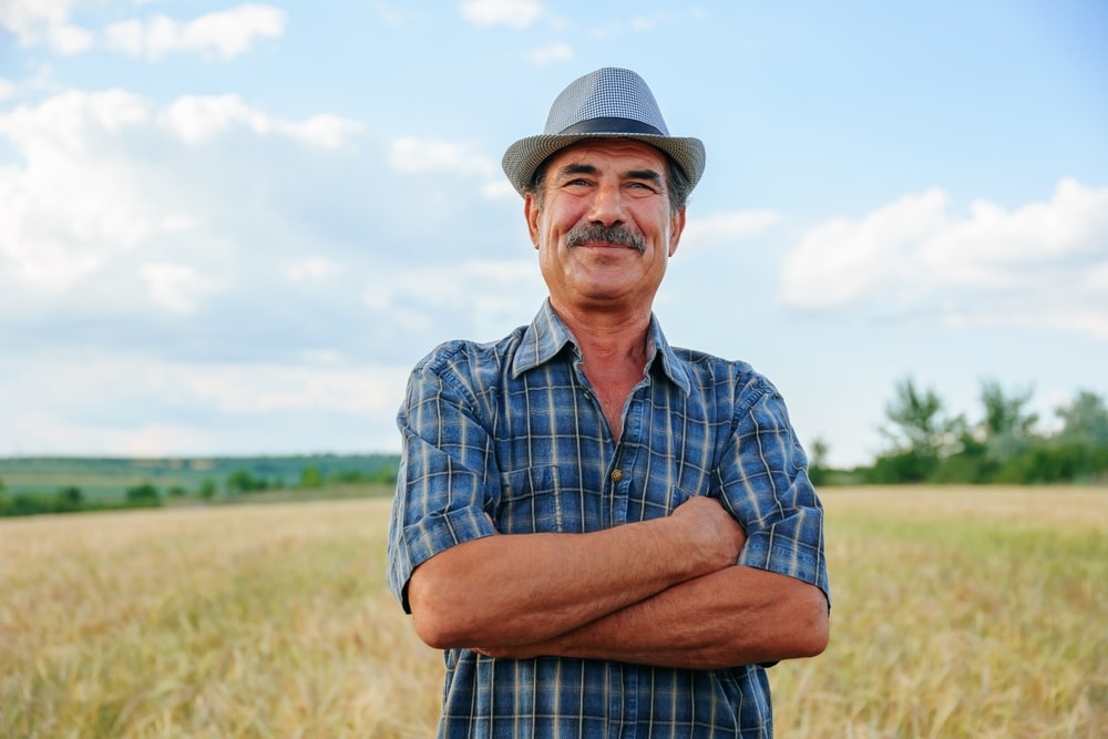 farmer with a mustache with arms crossed